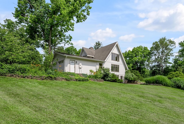 2968 Delong Rd, Lexington, KY 40515 - view of side of home featuring a chimney, a lawn, and an attached garage