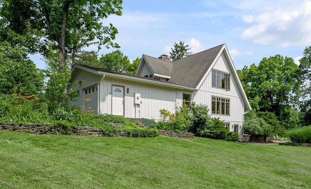 2968 Delong Rd, Lexington, KY 40515 - view of front of house with a chimney, a front lawn, and a shingled roof