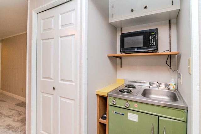 395 Redding Rd Unit 30, Lexington, KY 40517 - kitchen featuring black microwave, open shelves, carpet floors, white cabinets, and light countertops