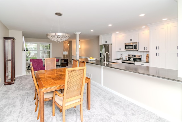 395 Redding Rd Unit 30, Lexington, KY 40517 - dining space with light colored carpet, recessed lighting, and decorative columns