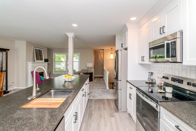 395 Redding Rd Unit 30, Lexington, KY 40517 - kitchen featuring stainless steel appliances, light wood finished floors, white cabinets, open floor plan, and recessed lighting