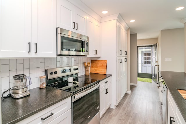 395 Redding Rd Unit 30, Lexington, KY 40517 - kitchen featuring stainless steel appliances, tasteful backsplash, recessed lighting, white cabinets, and light wood finished floors