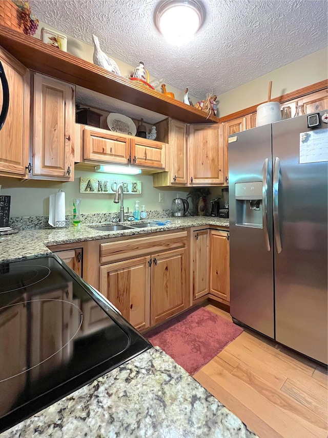 250 Hilltop Ests, Morehead, KY 40351 - kitchen with stainless steel fridge, range with electric cooktop, light wood-style floors, a textured ceiling, and light stone counters