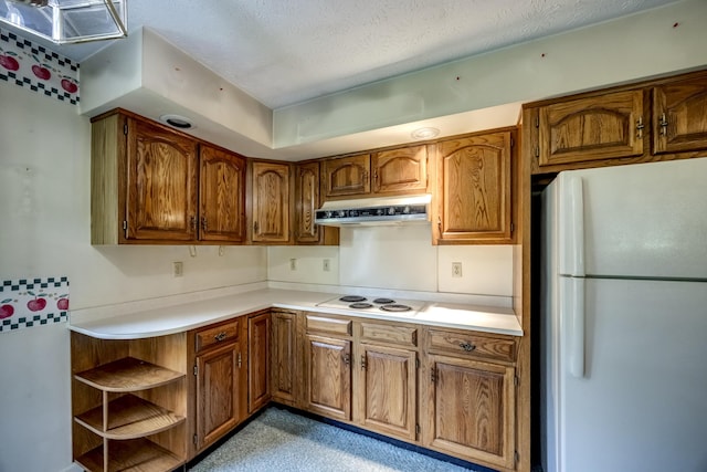 560 Kemper Ln, Danville, KY 40422 - kitchen with white appliances, under cabinet range hood, brown cabinets, and a textured ceiling