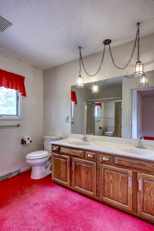 560 Kemper Ln, Danville, KY 40422 - full bath with double vanity, a shower with shower door, a textured ceiling, and carpet floors