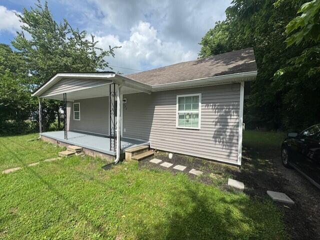 524 Clark St, Danville, KY 40422 - view of front of home with a front lawn and a shingled roof