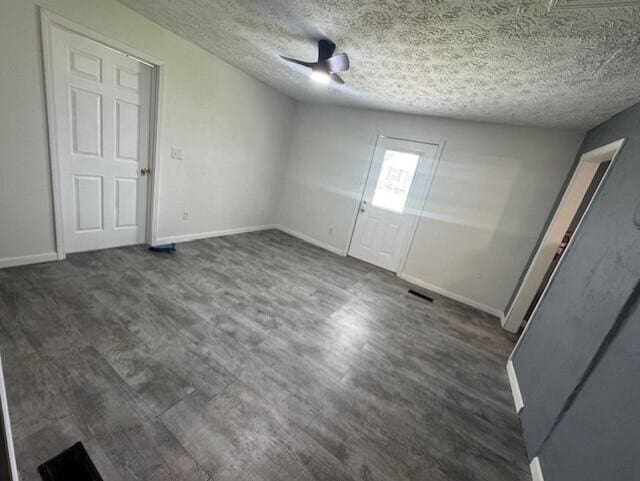 524 Clark St, Danville, KY 40422 - unfurnished bedroom with dark wood-style flooring, a textured ceiling, and a ceiling fan