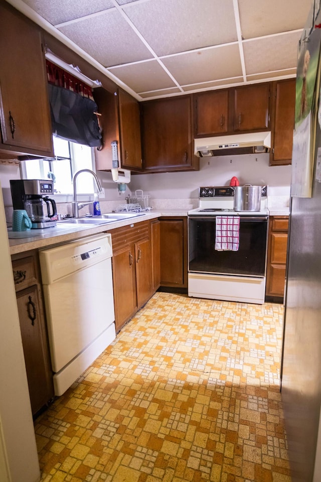 1181 Tracy Rd, Lawrenceburg, KY 40342 - kitchen with white appliances, under cabinet range hood, a paneled ceiling, and light countertops