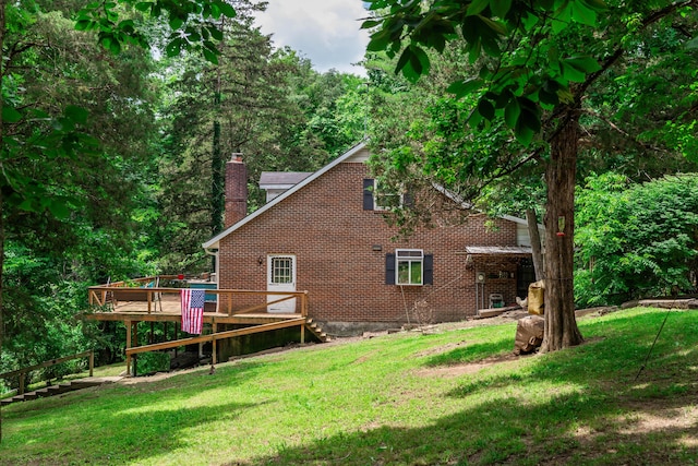 1181 Tracy Rd, Lawrenceburg, KY 40342 - back of house with a wooden deck, a chimney, a yard, and brick siding
