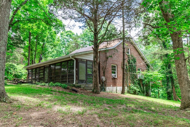 1181 Tracy Rd, Lawrenceburg, KY 40342 - view of home's exterior featuring a sunroom and brick siding