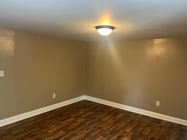2441 Rogers Rd, Lancaster, KY 40444 - unfurnished room with dark wood-type flooring and baseboards