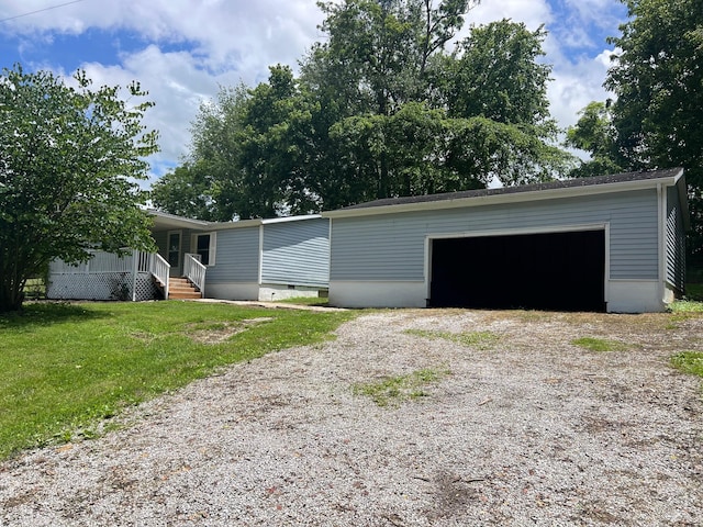 2441 Rogers Rd, Lancaster, KY 40444 - view of front facade with crawl space, an outdoor structure, a front lawn, and a garage
