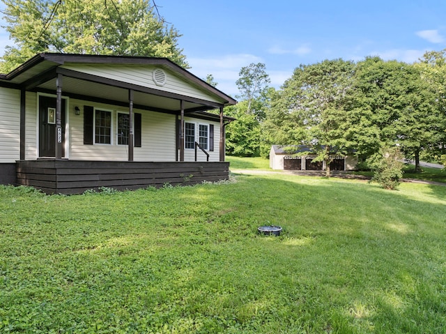 4822 US Highway 27 N, Cynthiana, KY 41031 - view of front of house featuring a porch, a front lawn, and a storage unit