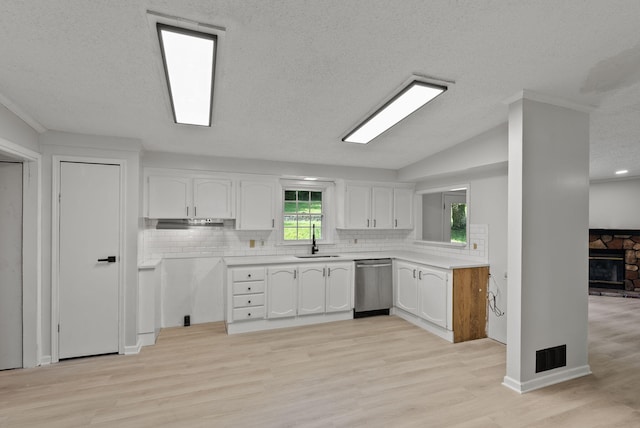 4822 US Highway 27 N, Cynthiana, KY 41031 - kitchen featuring stainless steel dishwasher, white cabinets, tasteful backsplash, light wood-style floors, and a textured ceiling