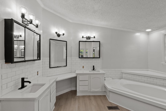 4822 US Highway 27 N, Cynthiana, KY 41031 - full bathroom with a textured ceiling, two vanities, a garden tub, wood finished floors, and ornamental molding