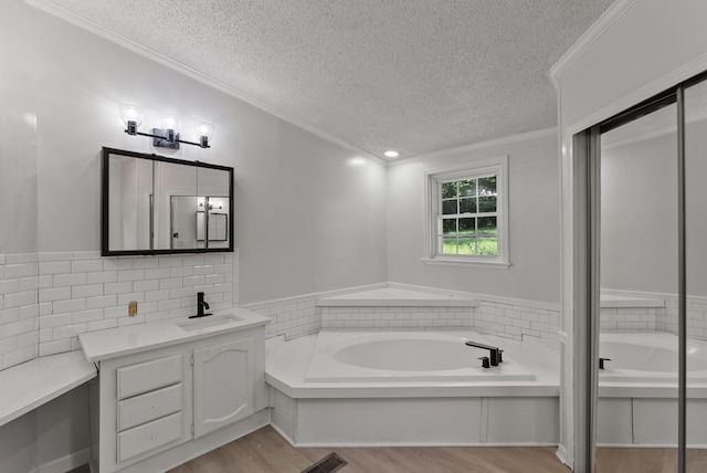 4822 US Highway 27 N, Cynthiana, KY 41031 - bathroom featuring a textured ceiling, vanity, ornamental molding, a bath, and wood finished floors