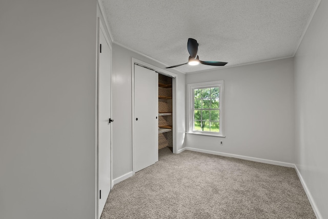 4822 US Highway 27 N, Cynthiana, KY 41031 - unfurnished bedroom with carpet floors, a textured ceiling, crown molding, a closet, and a ceiling fan