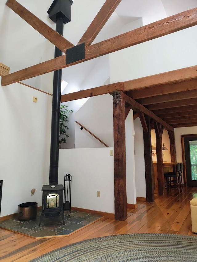 224 Pine Valley Rd, Berea, KY 40403 - unfurnished living room featuring hardwood / wood-style floors and a wood stove