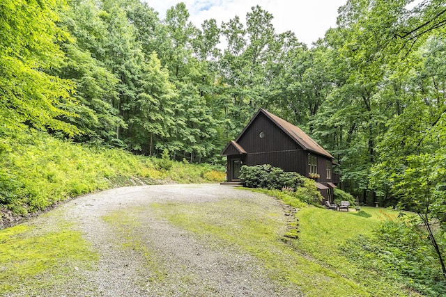 224 Pine Valley Rd, Berea, KY 40403 - view of front of home with gravel driveway and a forest view