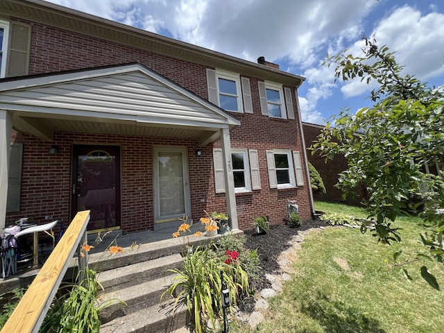 20 Heather Ln, Winchester, KY 40391 - view of property with brick siding, a front lawn, and a chimney