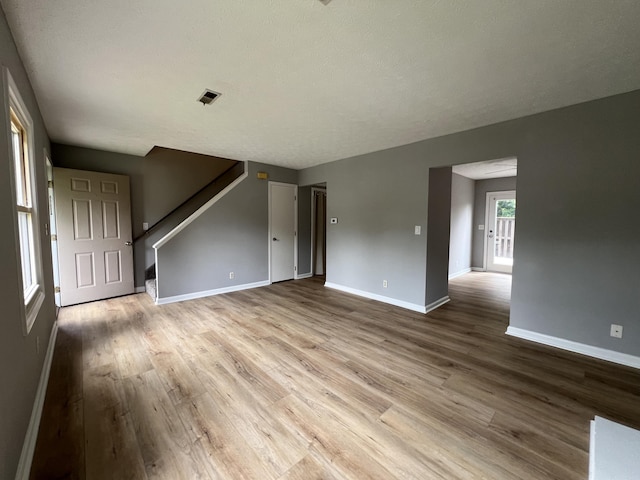 20 Heather Ln, Winchester, KY 40391 - unfurnished living room with wood finished floors and stairs