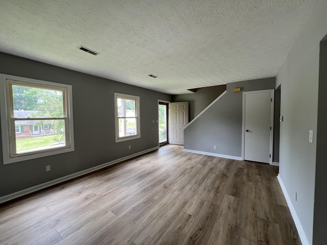 20 Heather Ln, Winchester, KY 40391 - empty room featuring a textured ceiling, wood finished floors, and stairway