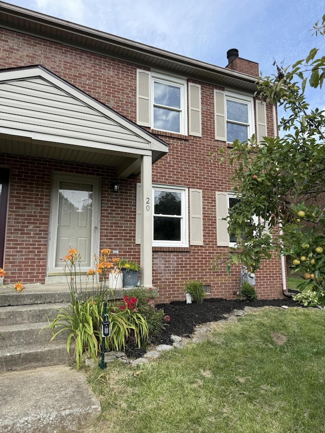 20 Heather Ln, Winchester, KY 40391 - view of front of property with brick siding, a front lawn, and a chimney