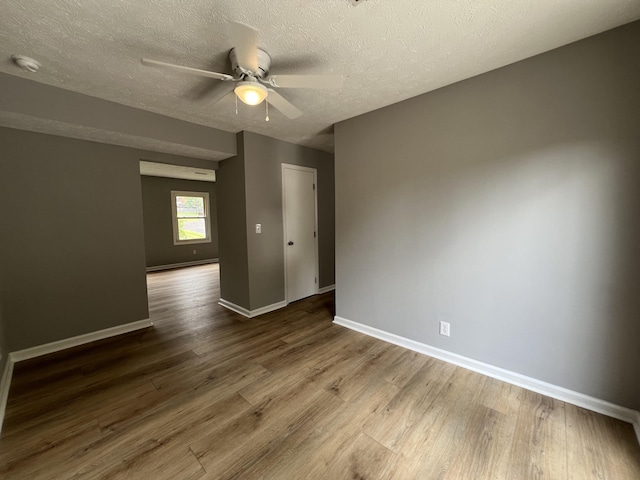 20 Heather Ln, Winchester, KY 40391 - empty room with a ceiling fan, wood finished floors, a textured ceiling, and a smoke detector