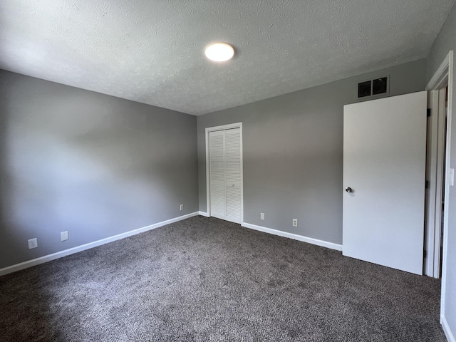20 Heather Ln, Winchester, KY 40391 - unfurnished bedroom with dark colored carpet, a textured ceiling, and a closet