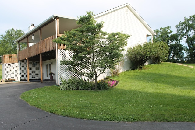 5515 Van Meter Rd, Winchester, KY 40391 - view of property exterior featuring a yard, a deck, asphalt driveway, and a chimney