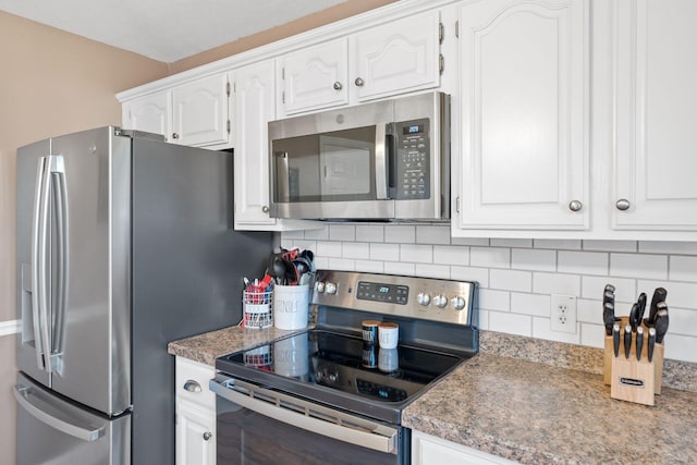 313 Man O War Ct, Lawrenceburg, KY 40342 - kitchen featuring appliances with stainless steel finishes, tasteful backsplash, and white cabinets