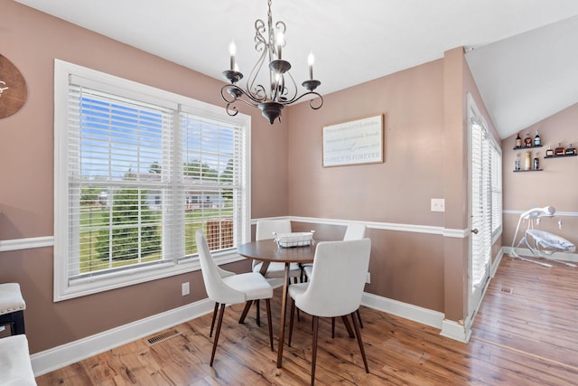 313 Man O War Ct, Lawrenceburg, KY 40342 - dining area with a chandelier, plenty of natural light, wood finished floors, and vaulted ceiling