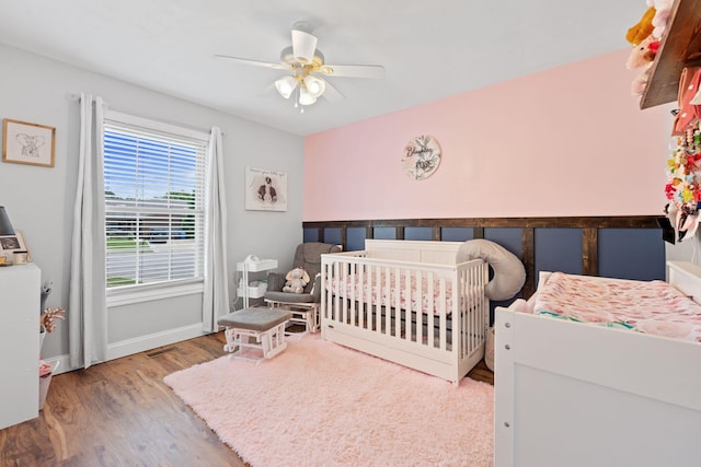 313 Man O War Ct, Lawrenceburg, KY 40342 - bedroom featuring wood finished floors, a nursery area, and a ceiling fan