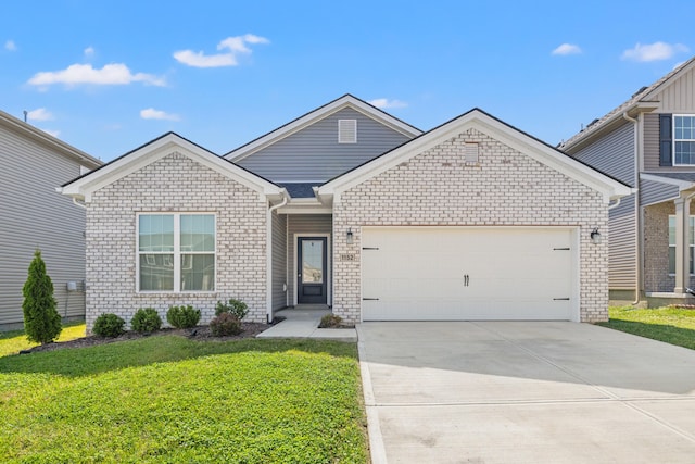 1152 Leanndra Park, Lexington, KY 40511 - view of front of house featuring a garage, concrete driveway, a front lawn, and brick siding