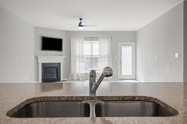 1152 Leanndra Park, Lexington, KY 40511 - kitchen with open floor plan, ceiling fan, and a glass covered fireplace