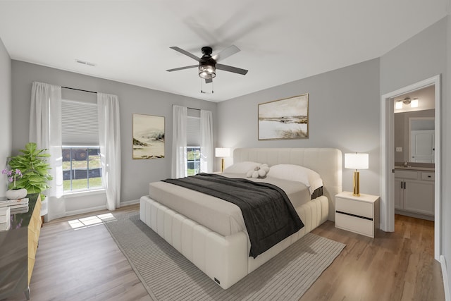 1152 Leanndra Park, Lexington, KY 40511 - bedroom featuring light wood-style flooring, a ceiling fan, and ensuite bathroom