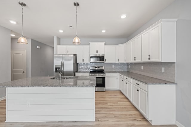 1152 Leanndra Park, Lexington, KY 40511 - kitchen featuring appliances with stainless steel finishes, light wood-style flooring, decorative backsplash, white cabinetry, and recessed lighting