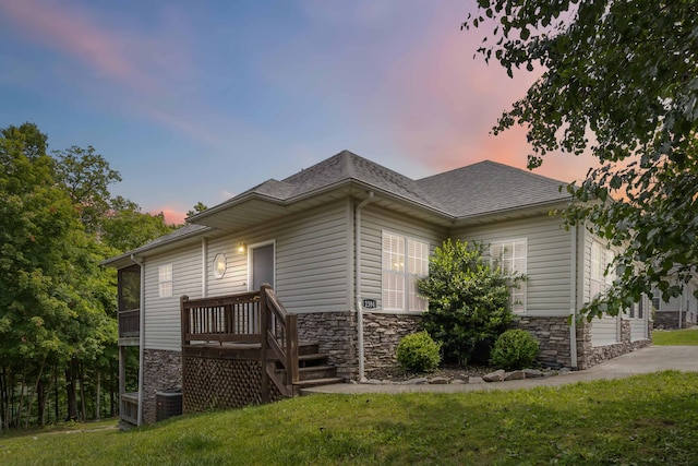 2394 Roberts Bend Rd, Burnside, KY 42519 - view of side of home featuring stone siding, a yard, and a shingled roof