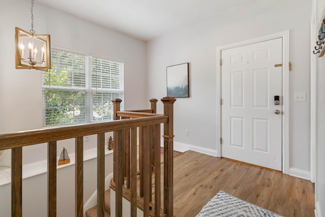 2394 Roberts Bend Rd, Burnside, KY 42519 - entryway with a chandelier and light wood finished floors