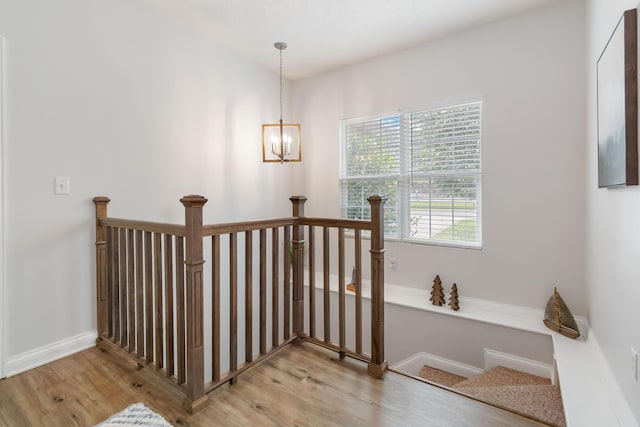 2394 Roberts Bend Rd, Burnside, KY 42519 - stairs with wood finished floors and a chandelier