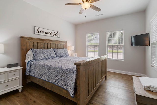2394 Roberts Bend Rd, Burnside, KY 42519 - bedroom with dark wood finished floors and a ceiling fan