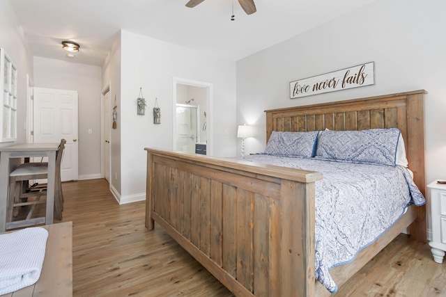 2394 Roberts Bend Rd, Burnside, KY 42519 - bedroom with light wood finished floors, a ceiling fan, and connected bathroom