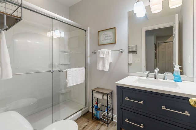 2394 Roberts Bend Rd, Burnside, KY 42519 - bathroom with vanity, a stall shower, and wood finished floors