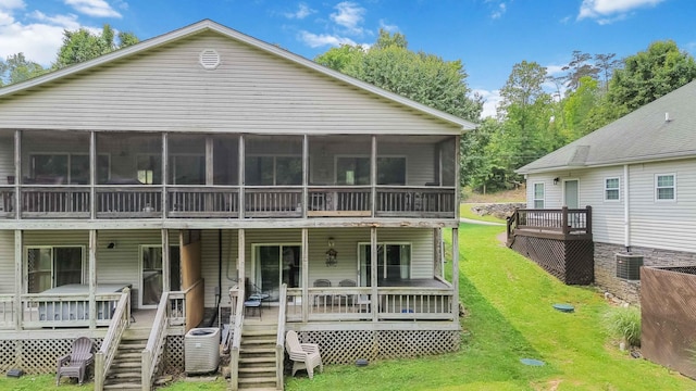 2394 Roberts Bend Rd, Burnside, KY 42519 - back of property with a sunroom, a lawn, stairs, and a wooden deck