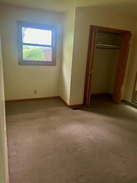 406 Forrest Dr, Lawrenceburg, KY 40342 - unfurnished bedroom with light carpet and a closet