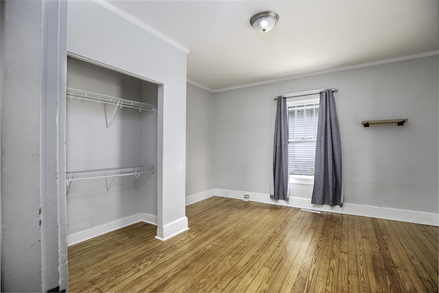 127 Locust Ave, Lexington, KY 40505 - unfurnished bedroom with wood-type flooring, a closet, and ornamental molding