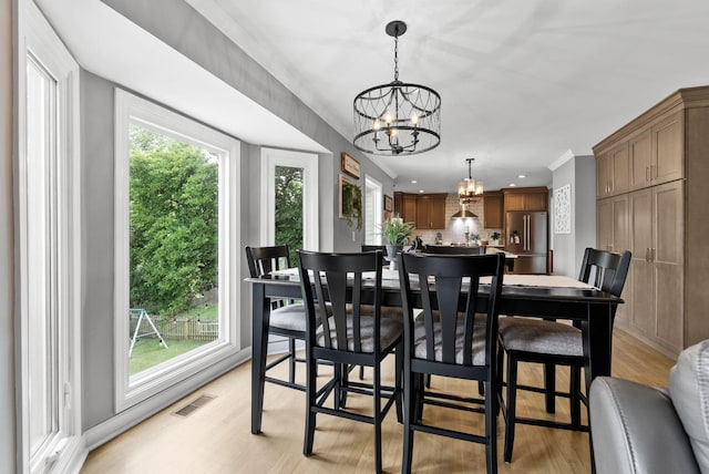 4109 Bridgemont Ln, Lexington, KY 40515 - dining space featuring a chandelier, light wood finished floors, recessed lighting, and crown molding