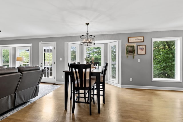 4109 Bridgemont Ln, Lexington, KY 40515 - dining area featuring ornamental molding, plenty of natural light, wood finished floors, and a chandelier
