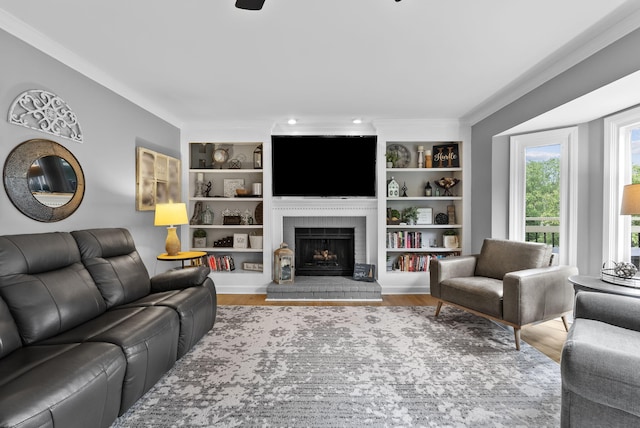 4109 Bridgemont Ln, Lexington, KY 40515 - living room featuring a brick fireplace, wood finished floors, built in shelves, and crown molding