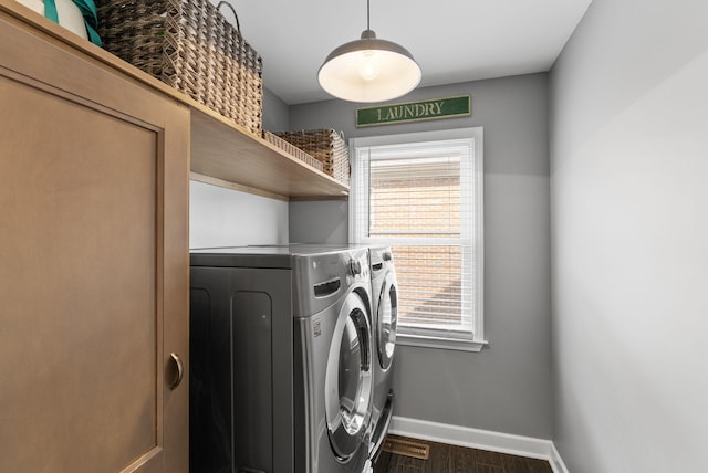 4109 Bridgemont Ln, Lexington, KY 40515 - washroom featuring independent washer and dryer, plenty of natural light, and dark wood-type flooring